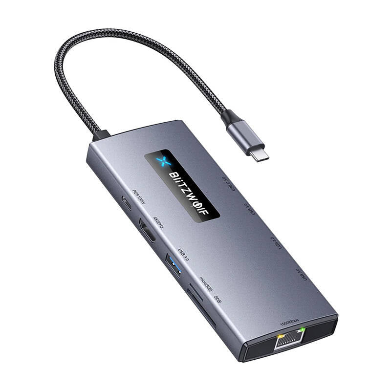 Hub USB-C plat en aluminium au câble tressé noir, ports HDMI, USB et RJ45 étiquetés sur les tranches