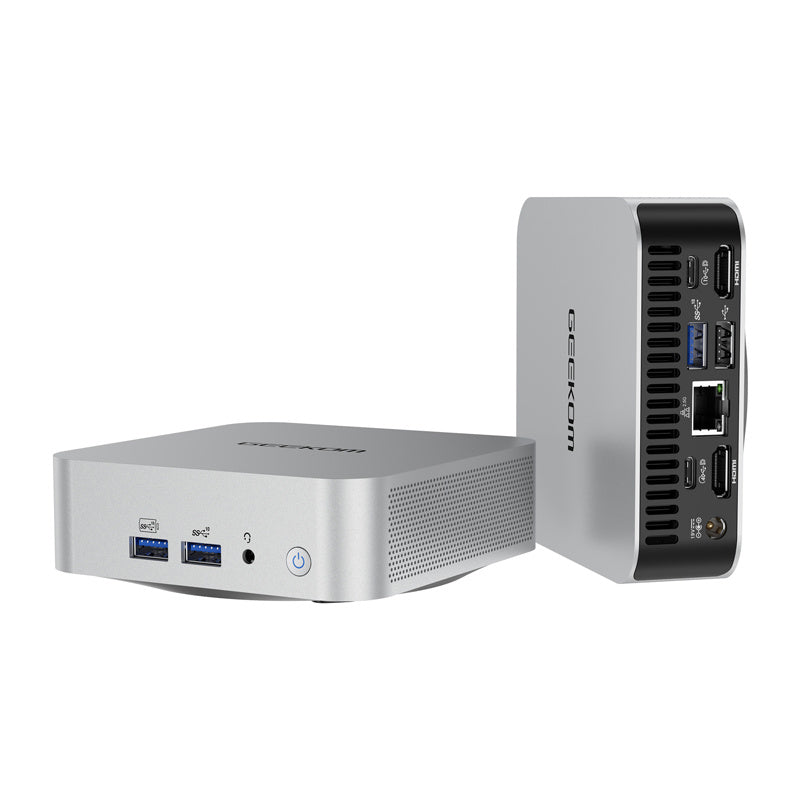 Mini PC compact en aluminium anodisé mat posé sur un bureau