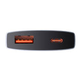 Baseus GaN5 - chargeur secteur 65 W, 1 port USB-C et 1 port USB-A, adaptateurs EU et UK : branché derrière un meuble